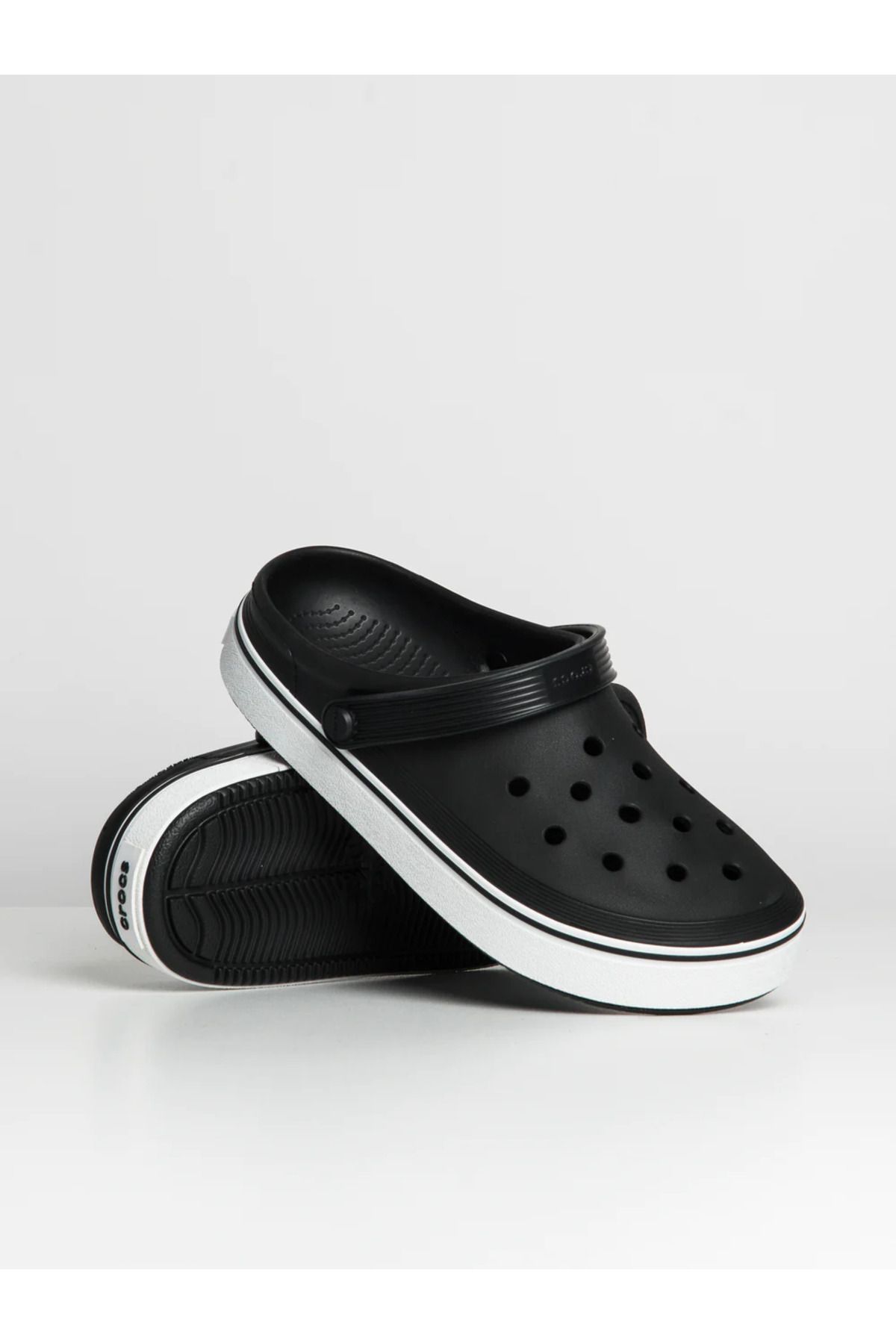 Black crocs with white outlet stripe