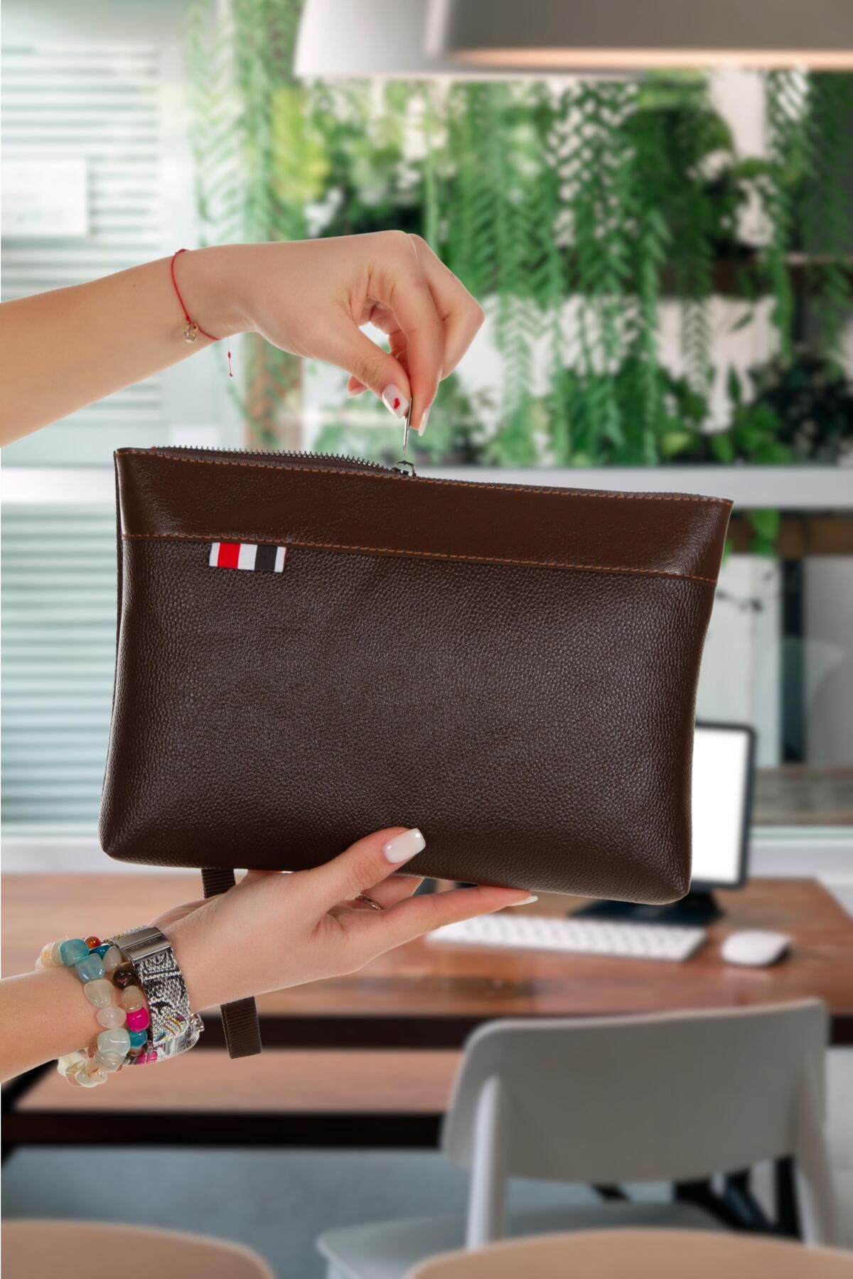Clutch bag top with hand strap