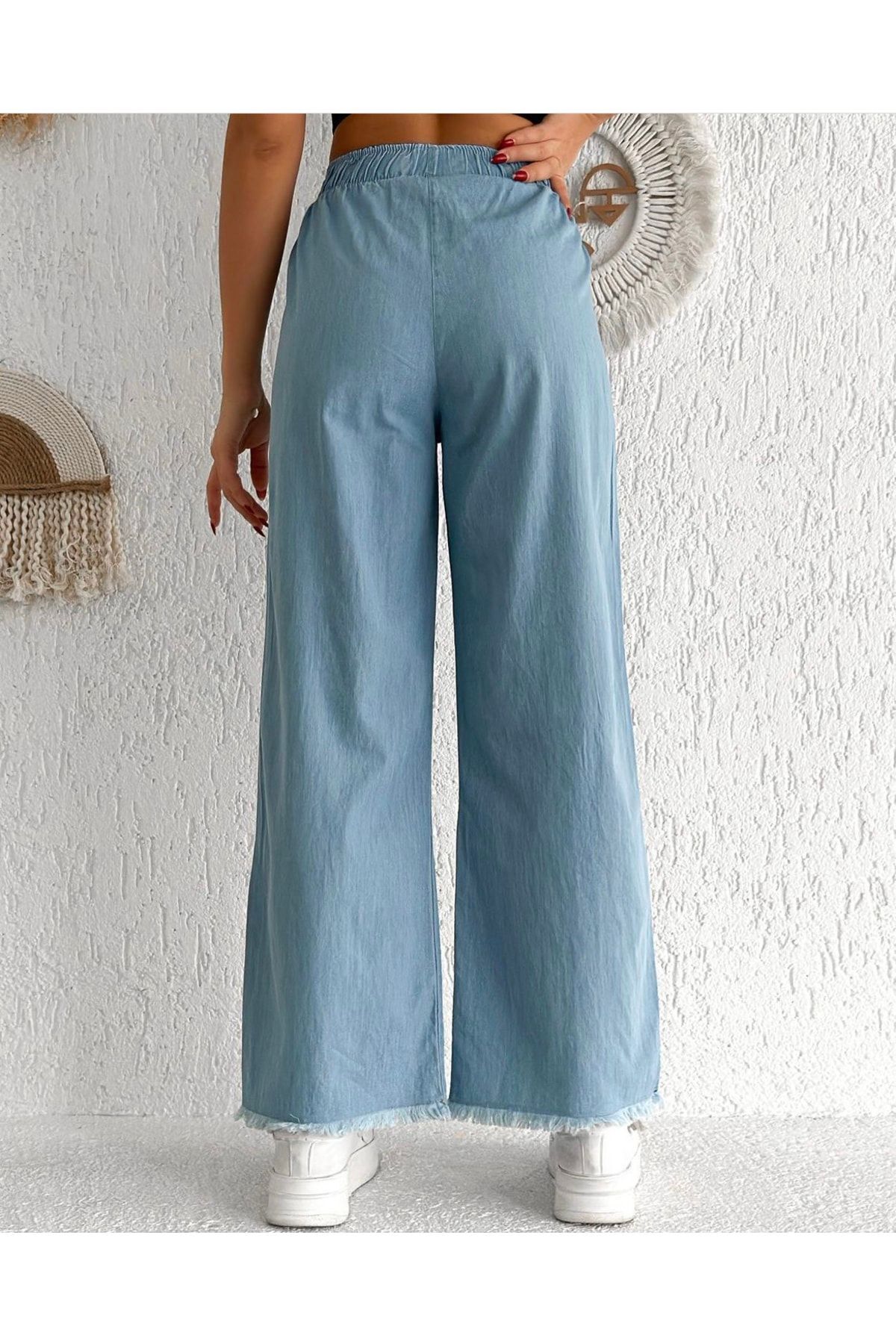 شلوار جین آبی باریک نخی منگوله دار کمر کش ساق کمر زنانه