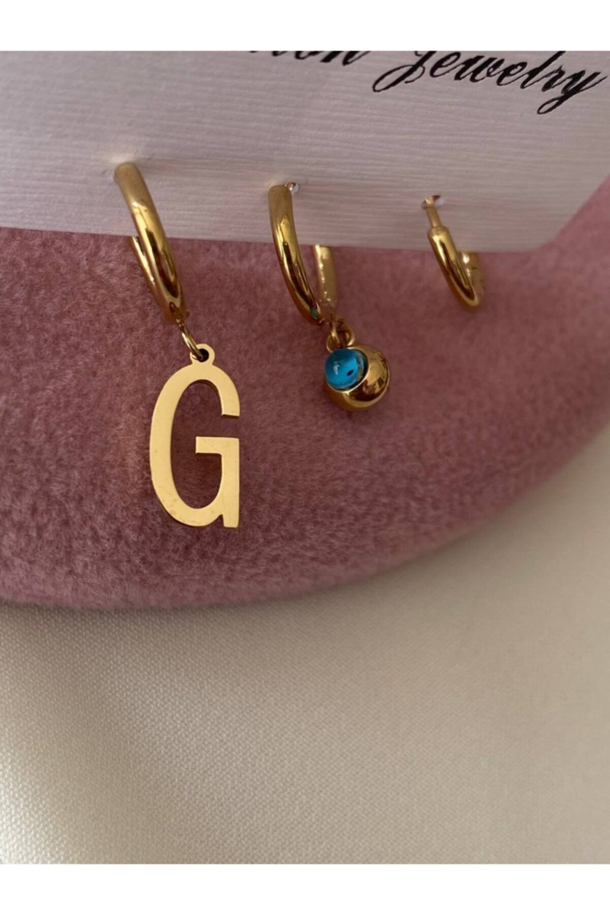 Esmeray Aksesuar Çelik Gold Renk Harf Ve Nazar Boncuk Sallantılı 3'lü Kombin Halka Küpe (g)