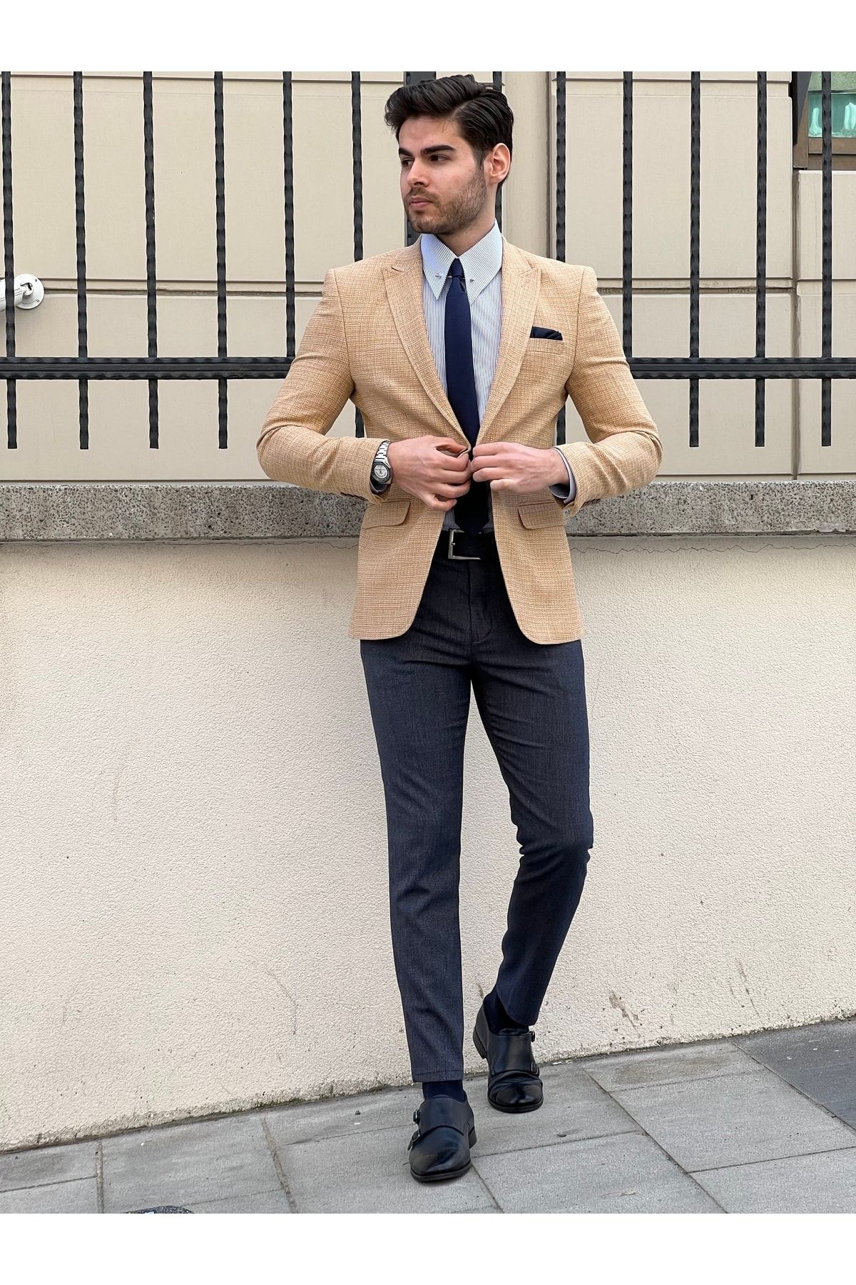 Tan sport top coat blue pants