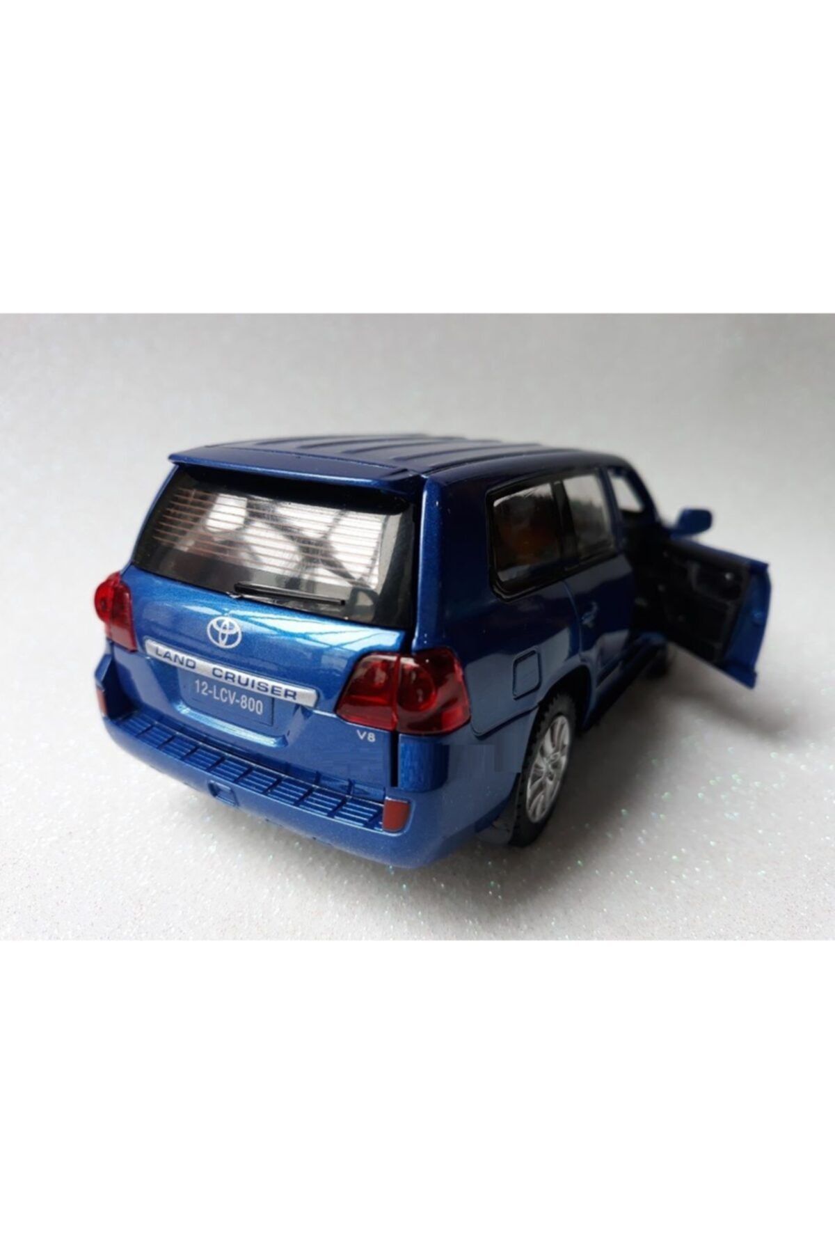 diecast toyota land cruiser v8 metal araba kapi bagaj ac orjinal oyuncak jip mavi fiyati yorumlari trendyol