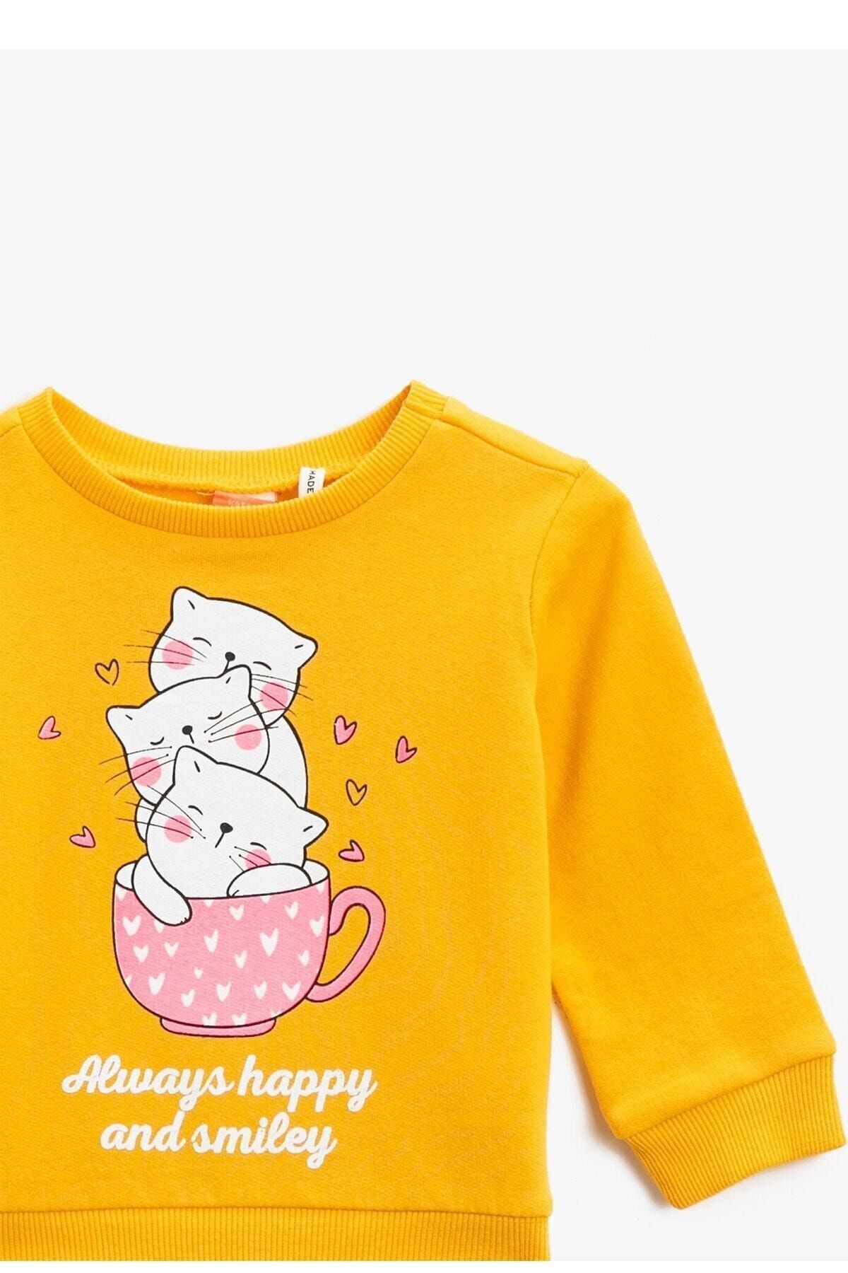 koton kiz bebek pamuklu baskili bisiklet yaka uzun kollu hardal sweatshirt 1kmg19798ok fiyati yorumlari trendyol