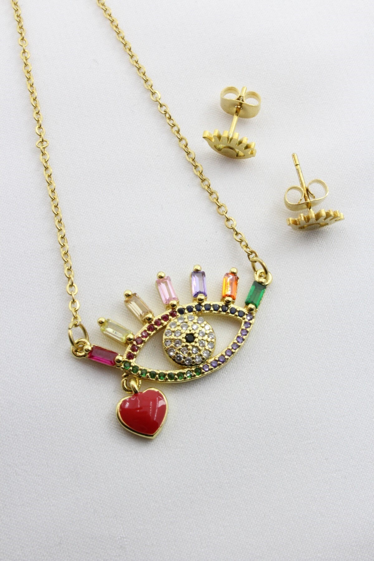 Bedimod Baget Kesim Zirkon Taşlı Göz Motifli Çelik Kolye Ve Küpe Set