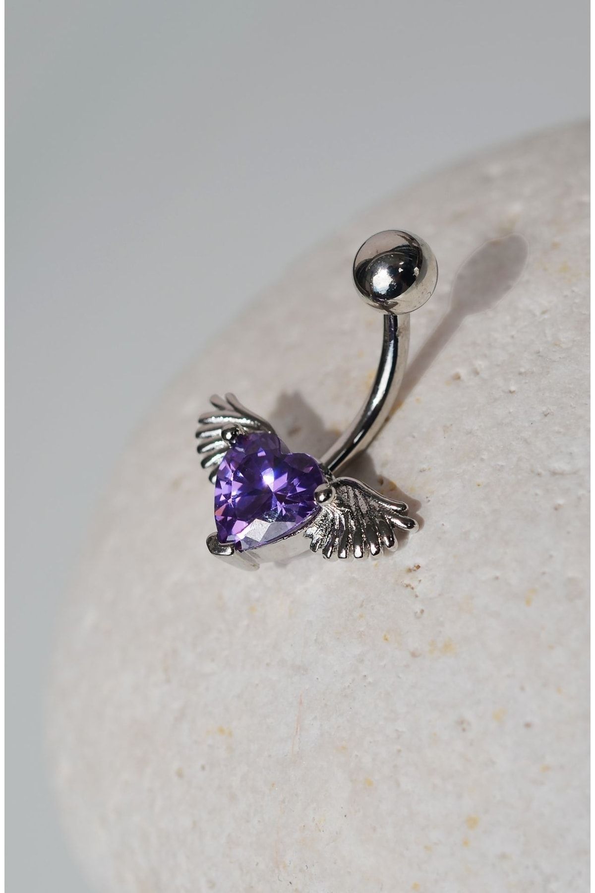 Purple belly top button piercing