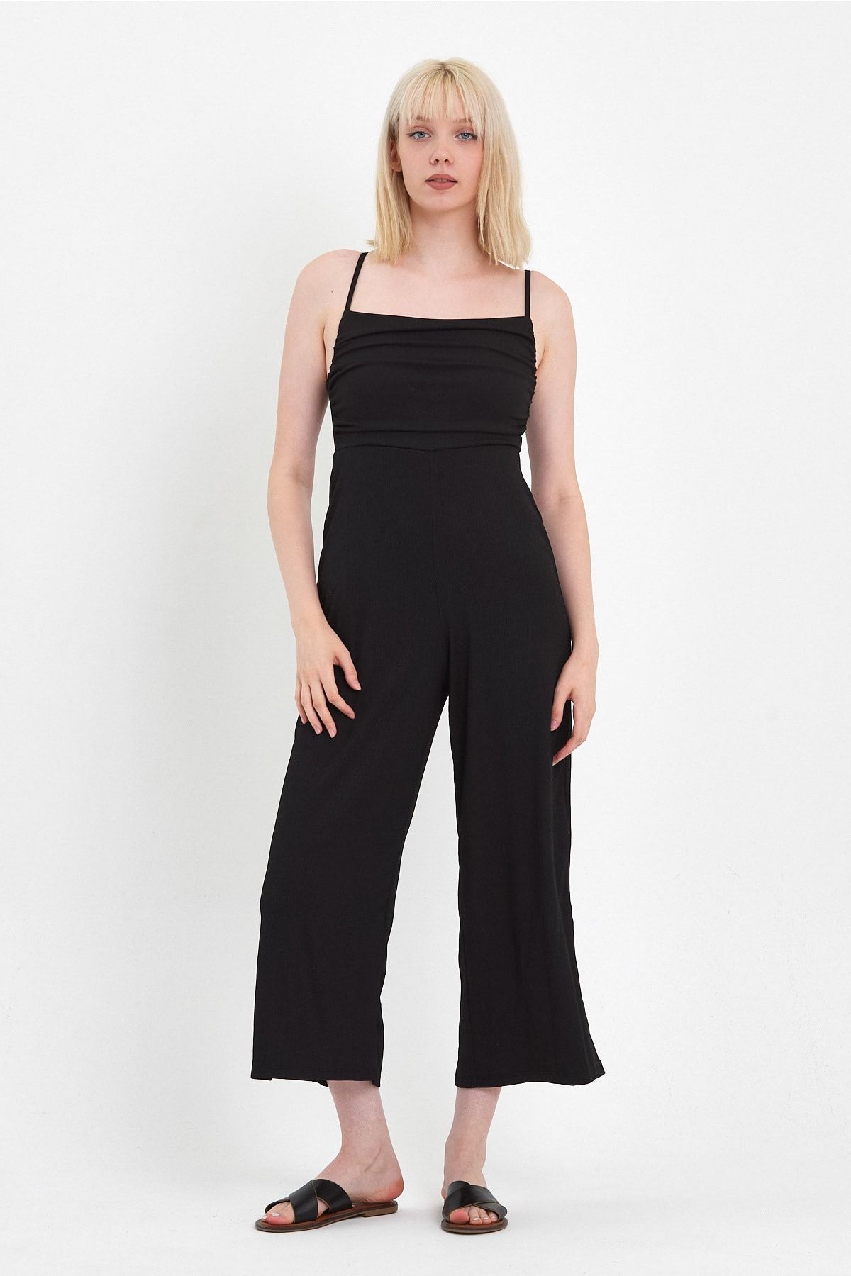 Strappy shop black jumpsuit
