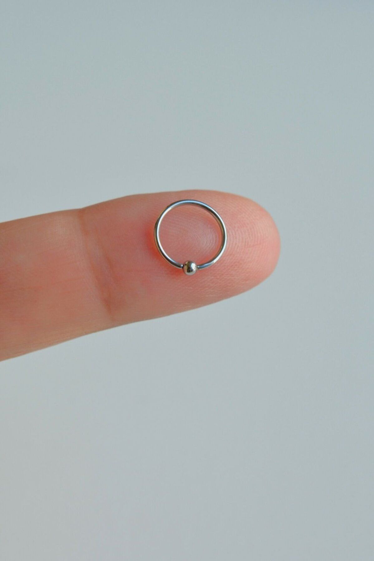 Small silver outlet nose ring