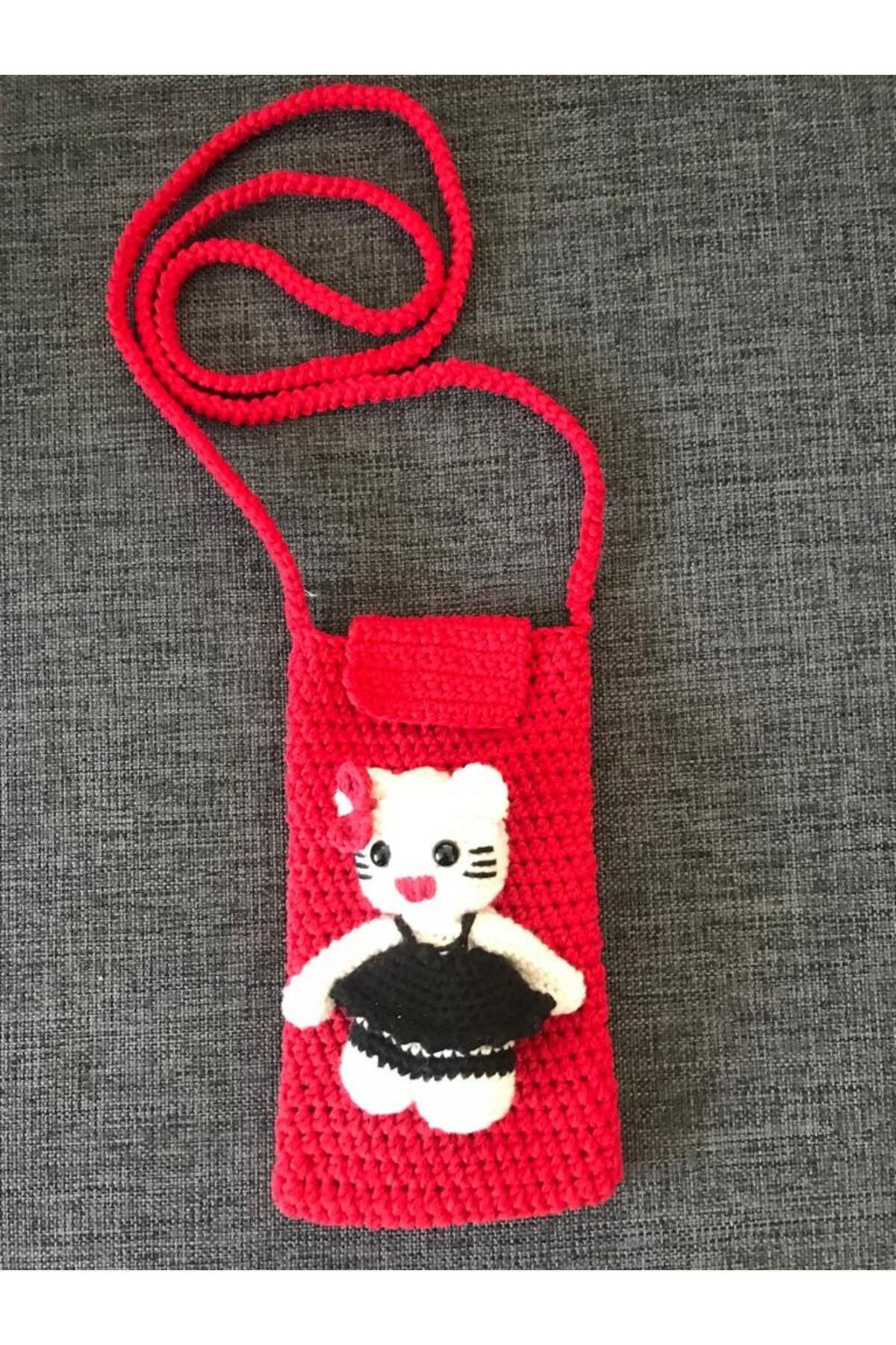 ŞEHR-İ PAZAR Kırmızı renk hello kitty figürlü telefon çantası