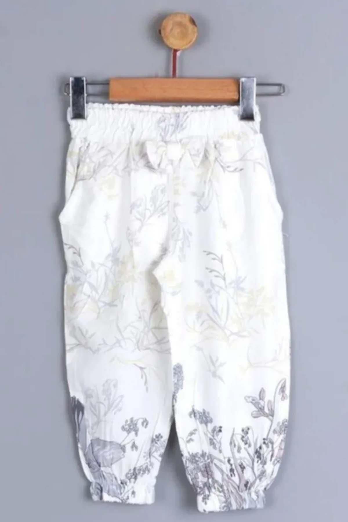 Riccotarz Kız Bebek Çiçek Baskı ve Fiyonk Detaylı Cepli Beyaz Pantolon