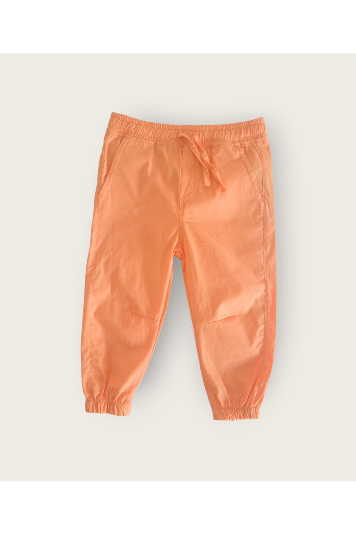 Divonette turuncu renk unisex çocuk cepli paçası ve beli lastikli dokuma pantolon