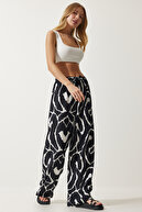 شلوار زنانه پر جنب و جوش با طرح مشکی و سفید ویسکوز پالازو EN00606-thumb