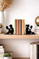 Boy and Girl Reading a Black Book