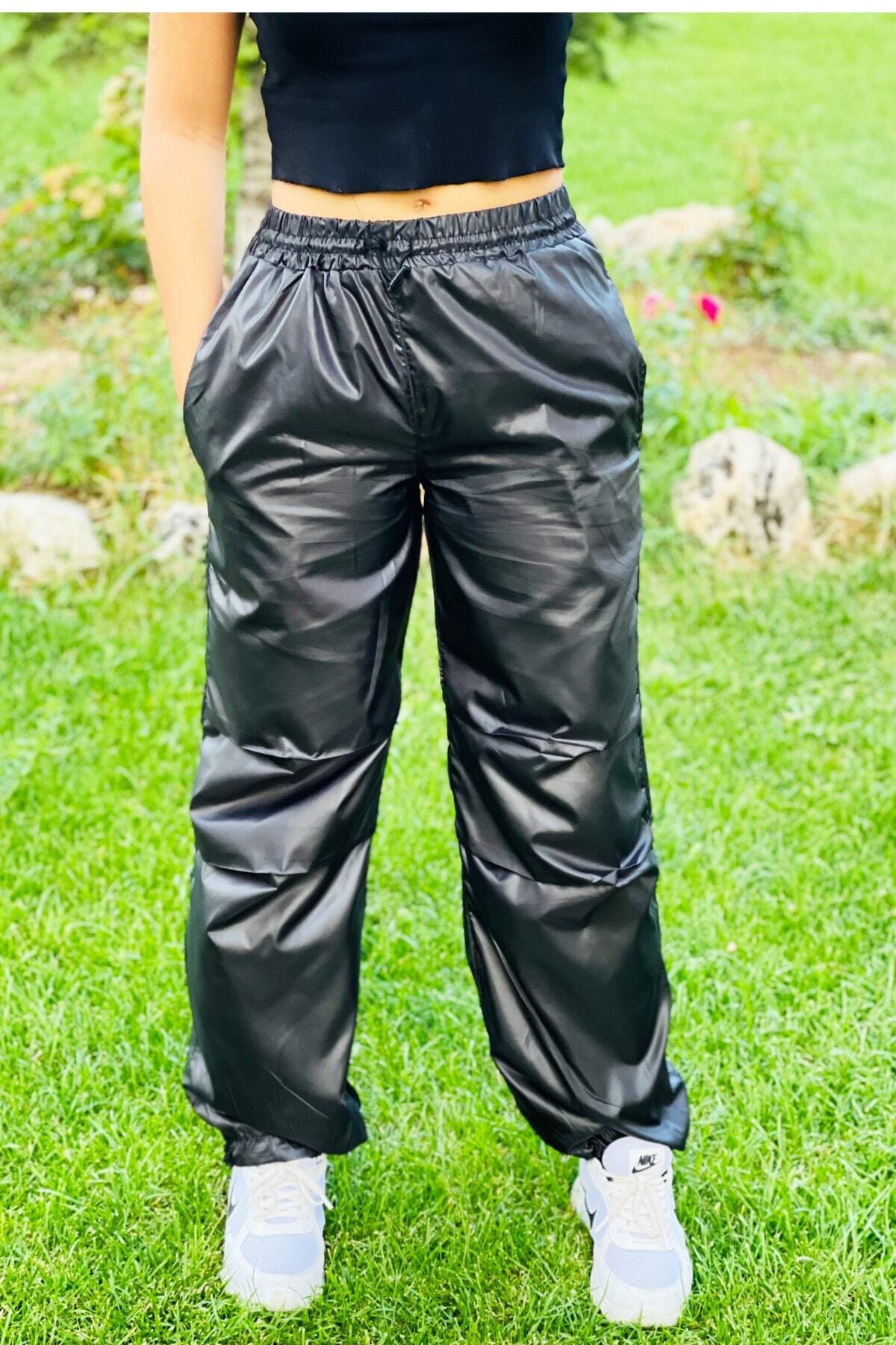 Shiny nylon track pants store