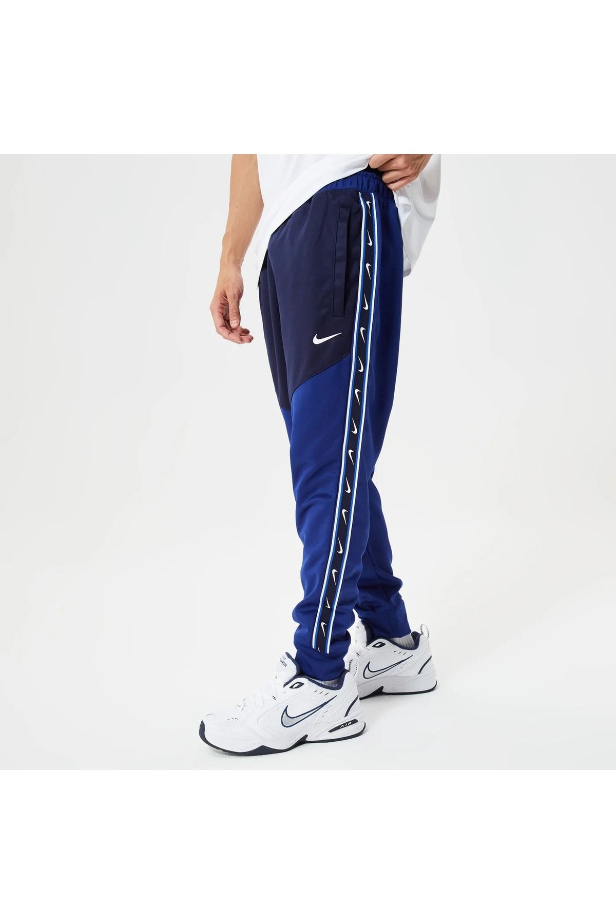 Nike hot sale tape trackpants