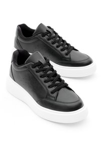 Related product image Tonny Black Sneakers