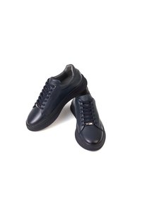 Related product image White Stone Sneakers