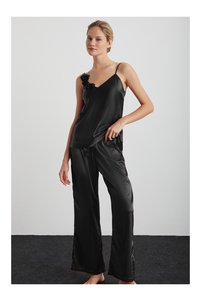 Related product image Kom Trousers