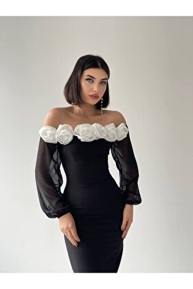 فستان أسود بياقة وردية وأكمام من التول