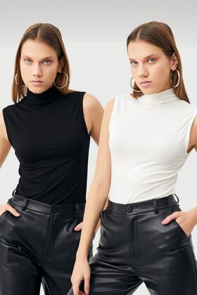 بدلة نسائية باللونين الأبيض والأسود مكونة من قطعتين بدون أكمام نصف رقبة