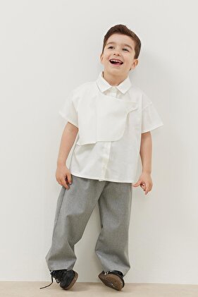 قميص مجزأ بلون كريمي