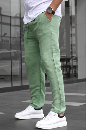 شلوار سبز مردانه پاچه لوله ای بافتنی فاق بلند کتان ریلکس کد 716349853