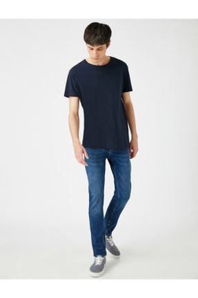 شلوار جین آبی مردانه پاچه تنگ فاق افتاده پنبه (نخی) کد 97931201