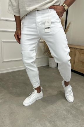 شلوار جین سفید مردانه پاچه کش دار پنبه (نخی) ساده بلند کد 813372543