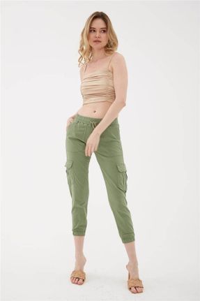 شلوار سبز زنانه جین پاچه تنگ کش دار جاگر کد 650199452
