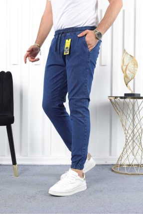 شلوار جین سرمه ای مردانه پاچه کش دار جین ساده پوشاک ورزشی استاندارد کد 786573245