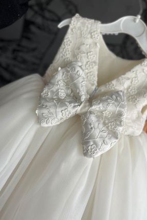 لباس سفید بچه گانه بافتنی طرح گلدار راحت کد 827148971