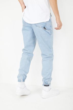 شلوار جین آبی مردانه پاچه کش دار فاق بلند نخ ساده کد 355105206