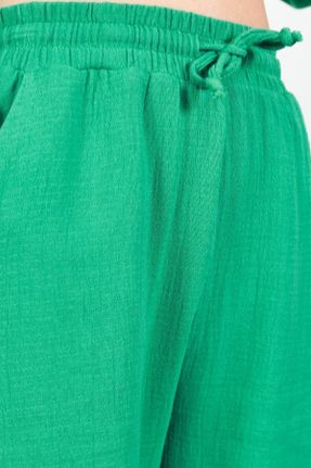 شلوار سبز زنانه پنبه (نخی) بافتنی پاچه تنگ فاق نرمال کد 692225007