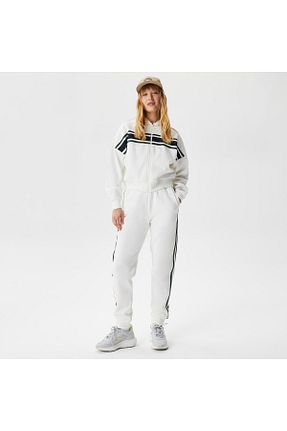 شلوار کرمگن سفید زنانه اسلیم فیت Lacoste - کد 701474099