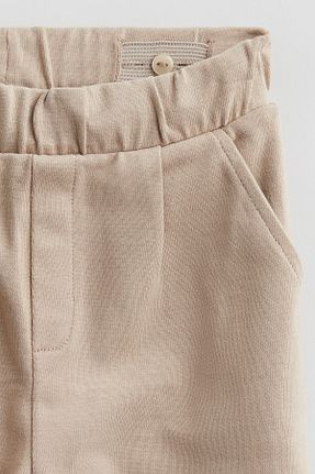 شلوار جین بژ بچه گانه پاچه لوله تفنگی H&M - کد 868753539