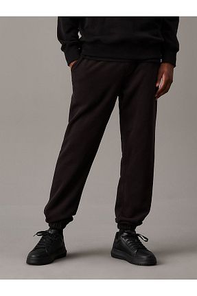 شلوار کرمگن مشکی مردانه پاچه کش دار Calvin Klein - کد 867263046