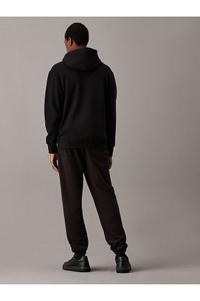 شلوار کرمگن مشکی مردانه پاچه کش دار Calvin Klein - کد 867263046