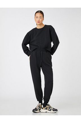 شلوار کرمگن مشکی زنانه پاچه تنگ Koton - کد 387428830