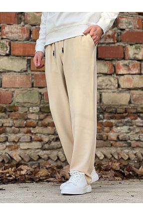 شلوار جین بژ زنانه پاچه کش دار ElitWear - کد 884234544