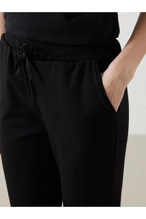شلوار کرمگن مشکی زنانه پاچه کش دار LC Waikiki - کد 905849307