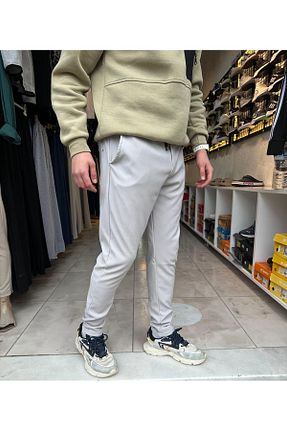 شلوار طوسی مردانه لیکرا HOMAN WEAR - کد 924554908