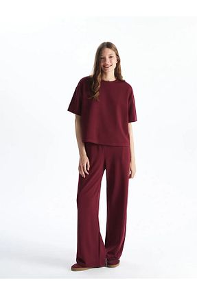 شلوار کرمگن زرشکی زنانه پاچه گشاد LC Waikiki - کد 926071268