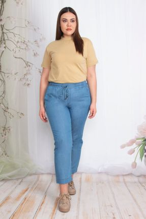 شلوار جین سایز بزرگ آبی زنانه پاچه لوله ای فاق نرمال کد 85892221