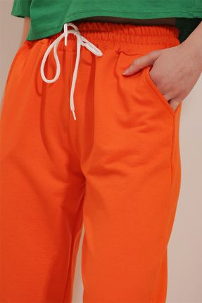پائین تنه گرمکن ورزشی نارنجی زنانه پاچه کش دار رگولار پنبه (نخی) کد 672387583