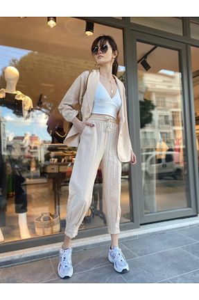 شلوار بژ زنانه پارچه HANDE ÇOLPAN - کد 673850449