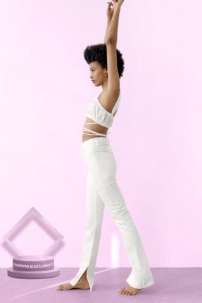 شلوار سفید زنانه جین پاچه اسپانیولی فاق بلند کد 727946941