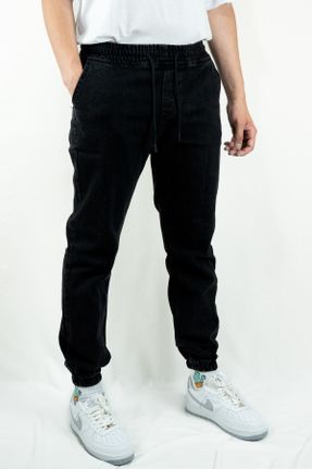شلوار جین مشکی مردانه پاچه کش دار اورسایز بلند کد 732070755