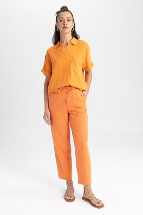 شلوار نارنجی زنانه بافتنی پاچه تنگ فاق نرمال جاگر کد 701996011