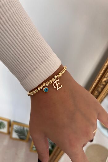 Trendy Butik E Harf ve Nazar Sallantılı Dorika Bileklik