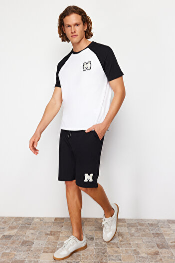 Trendyol Collection Black and White Embroidered Raglan Sleeve Knitted Shorts Pajamas Set TMNSS24PT00007