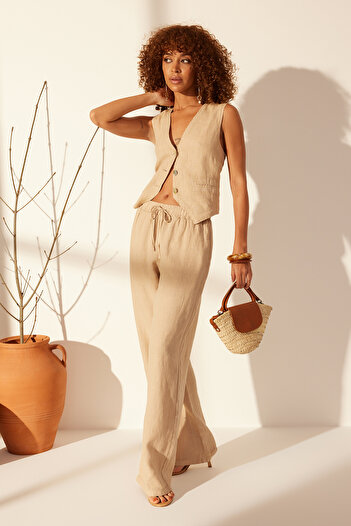 Trendyol Collection Μπεζ 100% λινό ελαστικό παντελόνι ψηλόμεσο φαρδύ πόδι TWOSS24JE00249